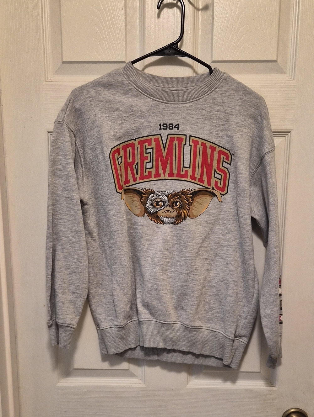 H&M Gremlins Graphic Crewneck Sweatshirt - Light Gray with Red and Gold Logo